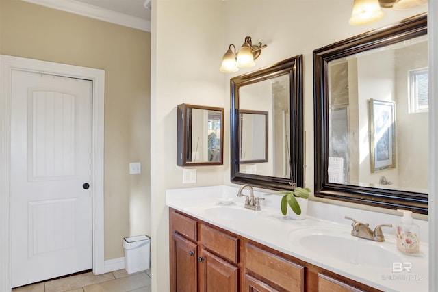 bathroom featuring tile patterned flooring, vanity, and crown molding