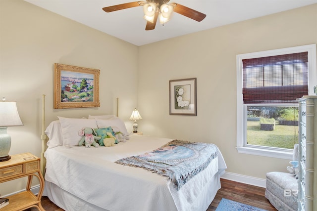 bedroom with ceiling fan and dark hardwood / wood-style flooring