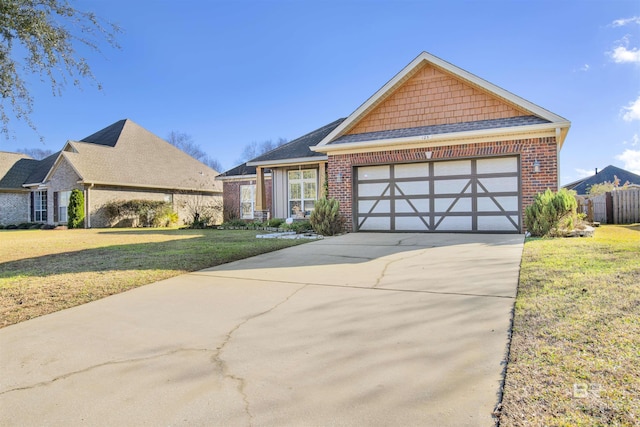 view of front of home featuring a garage and a front lawn