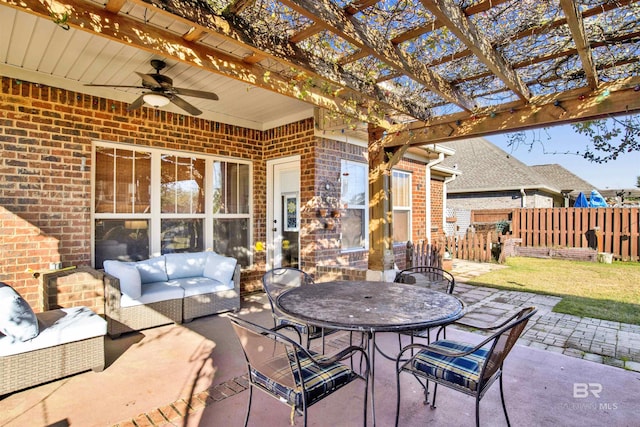 view of patio with outdoor lounge area, ceiling fan, and a pergola