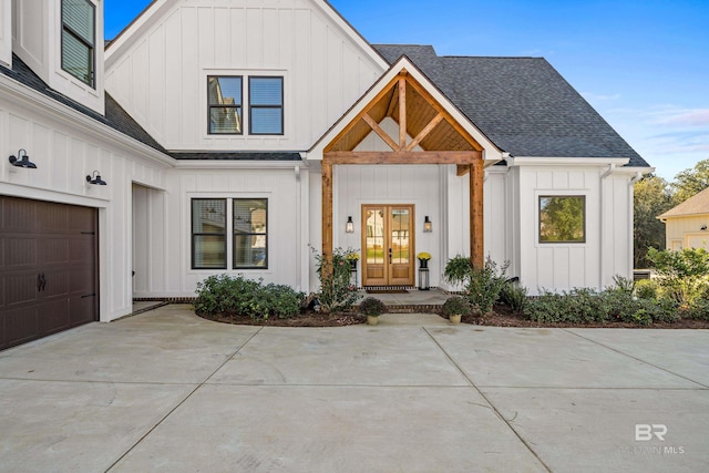 modern inspired farmhouse featuring a garage