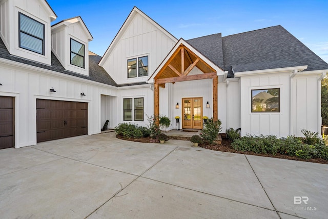 modern inspired farmhouse with french doors and a garage