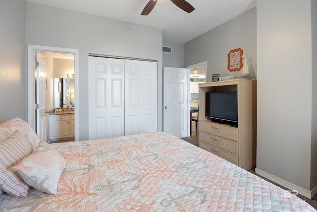 bedroom featuring ensuite bath, a closet, and ceiling fan