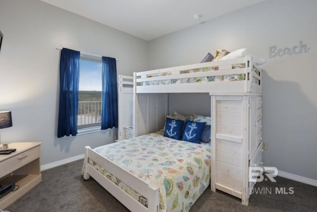 bedroom with dark colored carpet