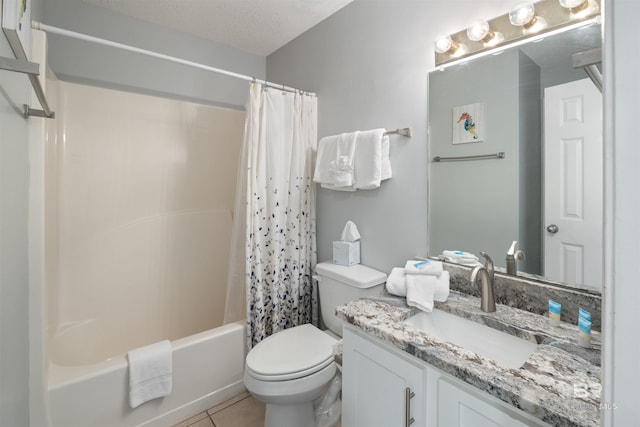 full bathroom with shower / tub combo, vanity, a textured ceiling, tile patterned floors, and toilet