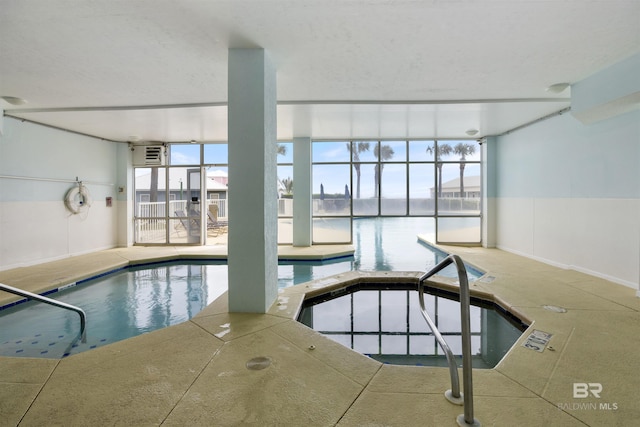 view of swimming pool featuring a water view