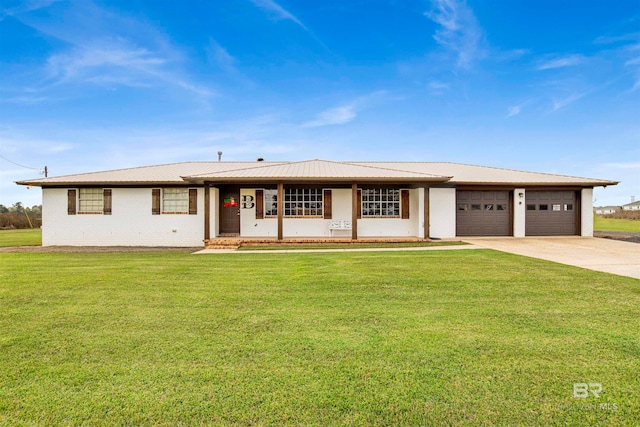 view of front facade with a porch, a garage, and a front lawn