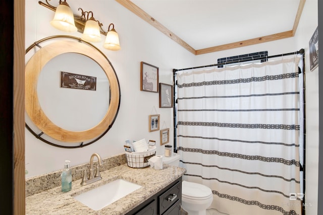 bathroom with a shower with curtain, vanity, toilet, and crown molding