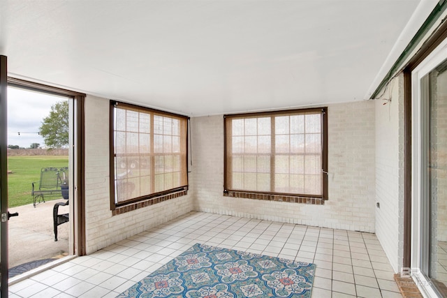 sunroom / solarium featuring a healthy amount of sunlight