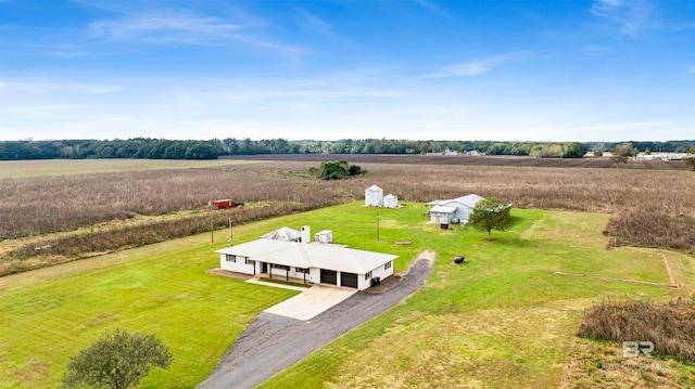 birds eye view of property with a rural view