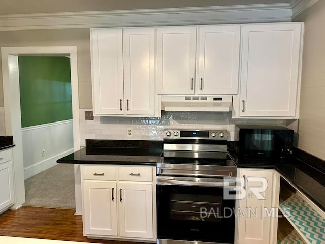 kitchen with white cabinetry, ornamental molding, backsplash, hardwood / wood-style floors, and stainless steel electric stove