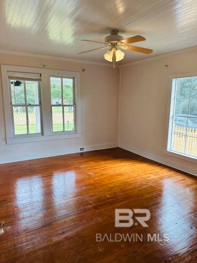 unfurnished room with hardwood / wood-style flooring, ceiling fan, and crown molding