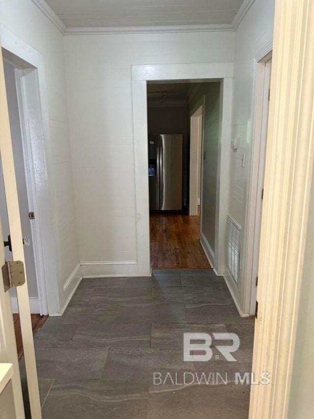 corridor with dark wood-type flooring and ornamental molding