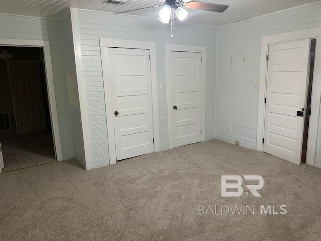 unfurnished bedroom with light carpet and ceiling fan