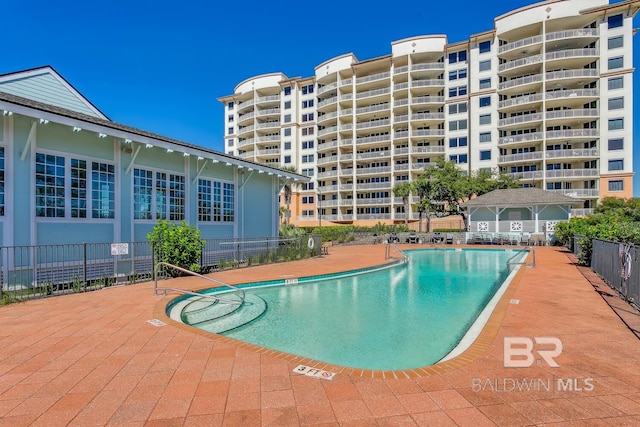 view of swimming pool with a patio area