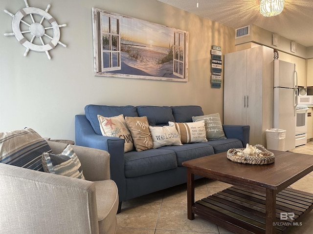 tiled living room with a textured ceiling