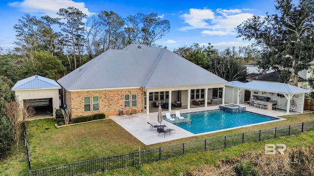 rear view of house featuring a fenced in pool, a yard, and a patio area