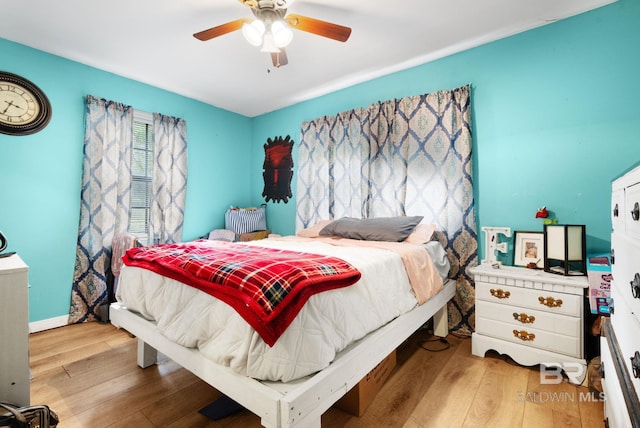 bedroom featuring ceiling fan and wood-type flooring