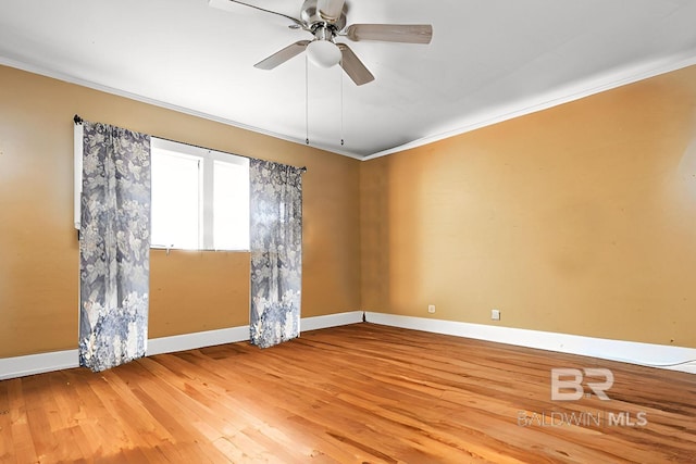 unfurnished room with ceiling fan, ornamental molding, and hardwood / wood-style floors