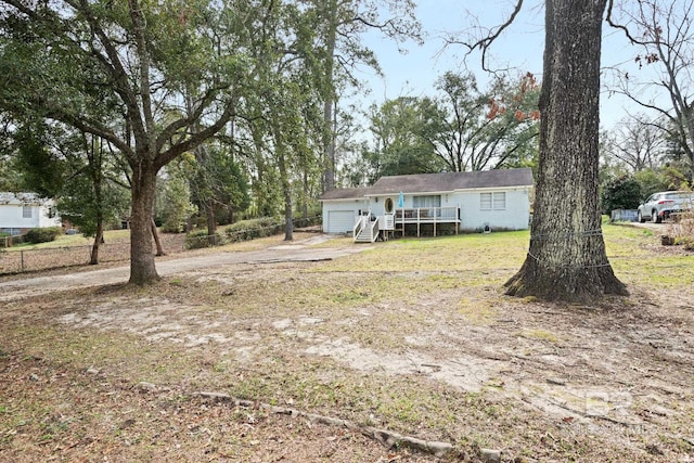 view of yard featuring a wooden deck