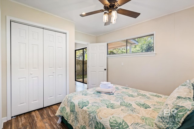 54 S Bishop Ln, Mobile, AL 36608 - bedroom featuring dark wood-style floors, a closet, crown molding, and a ceiling fan
