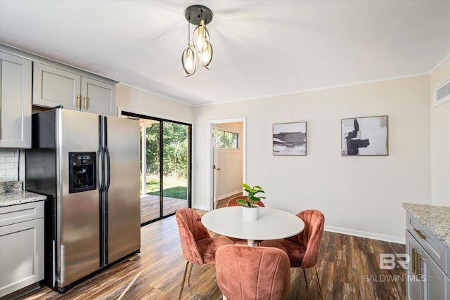 54 S Bishop Ln, Mobile, AL 36608 - dining area featuring baseboards, dark wood finished floors, and ornamental molding