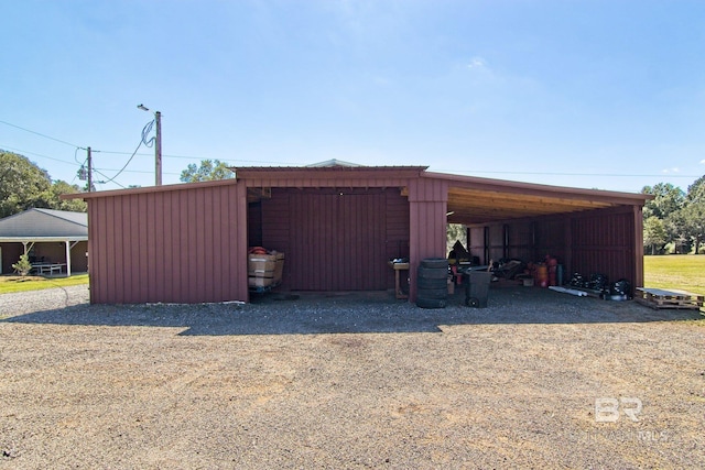 view of outdoor structure with a carport