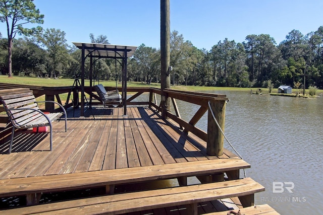 dock area with a water view and a pergola