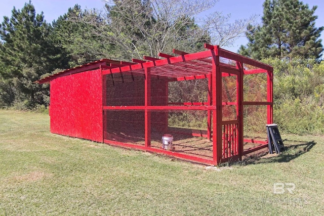 view of outbuilding featuring a yard