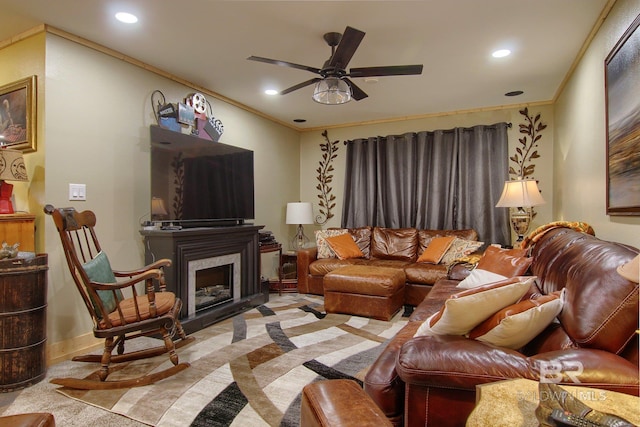 living room featuring light carpet, crown molding, and ceiling fan