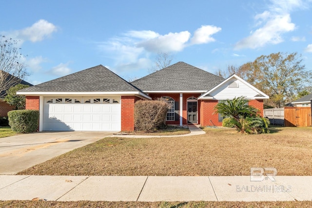 single story home with a garage and a front lawn