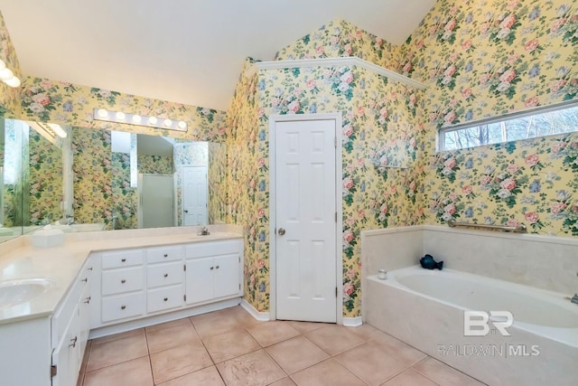 bathroom with tile patterned floors, vanity, lofted ceiling, and plus walk in shower