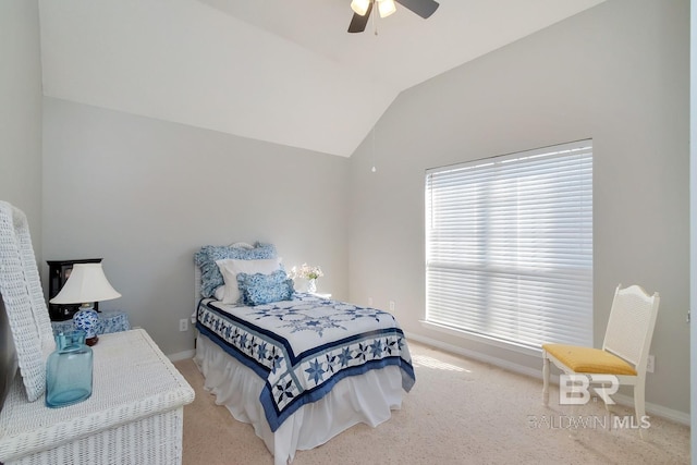 carpeted bedroom with ceiling fan, multiple windows, and vaulted ceiling