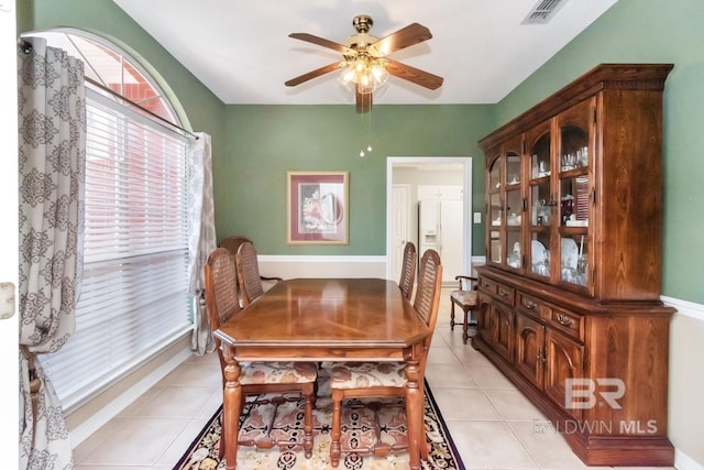 dining room featuring ceiling fan and light tile patterned floors