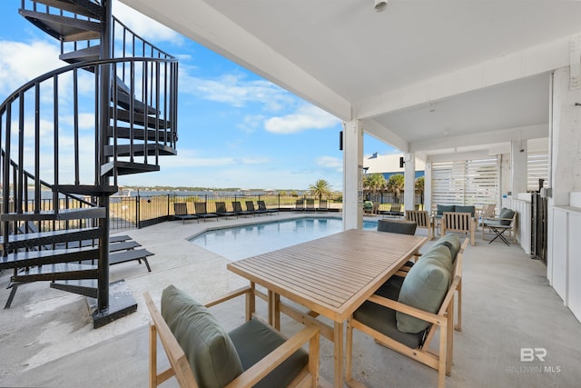 view of pool with a fenced in pool and a patio area