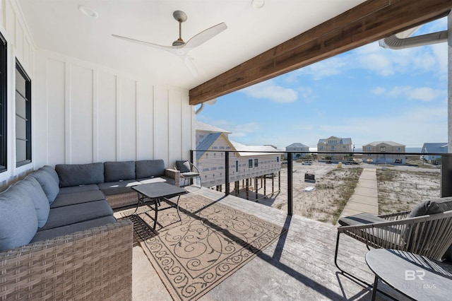 balcony featuring a ceiling fan and an outdoor living space