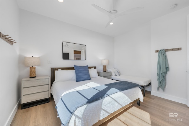 bedroom featuring baseboards, light wood-style flooring, and recessed lighting
