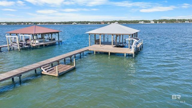 dock area featuring a water view and boat lift