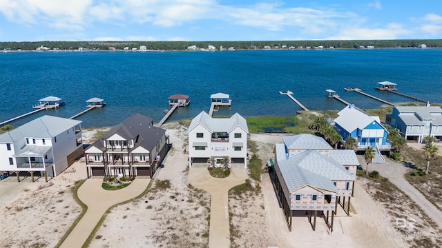 bird's eye view with a residential view and a water view