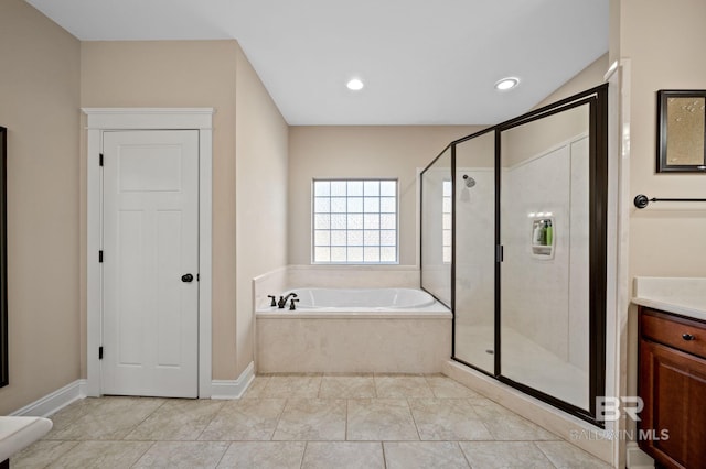 full bathroom with a stall shower, baseboards, vanity, a bath, and recessed lighting