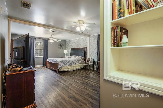 bedroom featuring wood-type flooring and ceiling fan