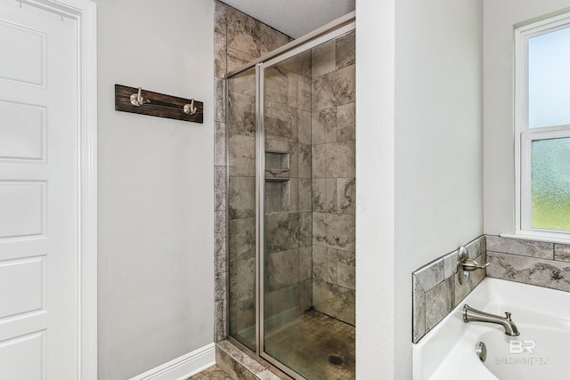 bathroom with shower with separate bathtub