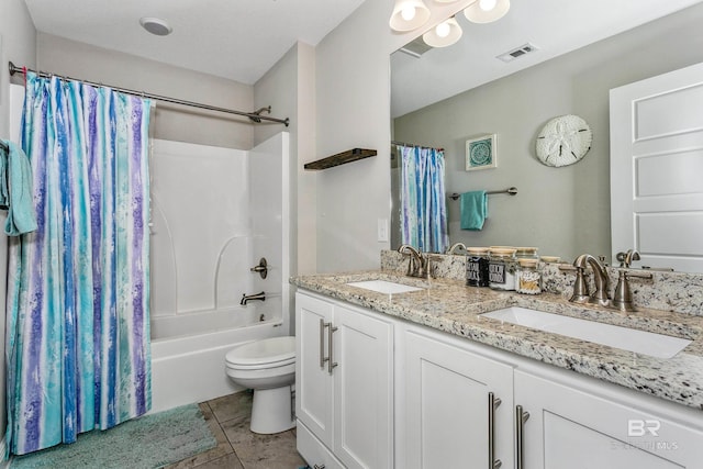 full bathroom with vanity, shower / bath combination with curtain, tile patterned floors, and toilet