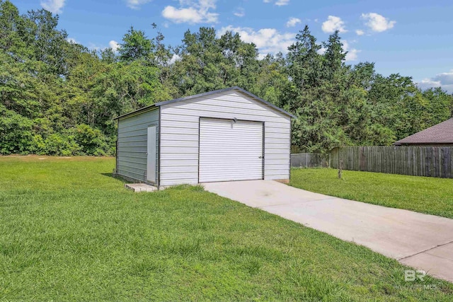 garage featuring a lawn