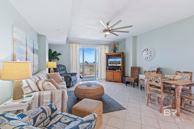 tiled living room featuring ceiling fan