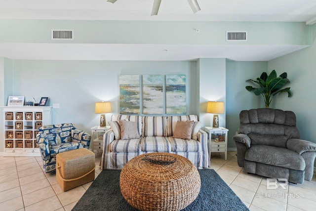 living room with ceiling fan and light tile patterned flooring