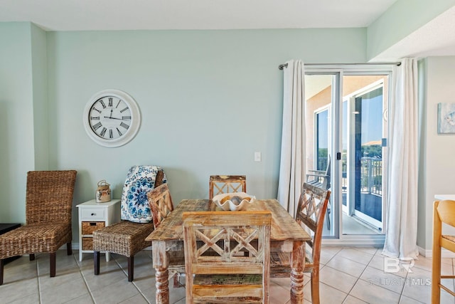 tiled dining room with a healthy amount of sunlight