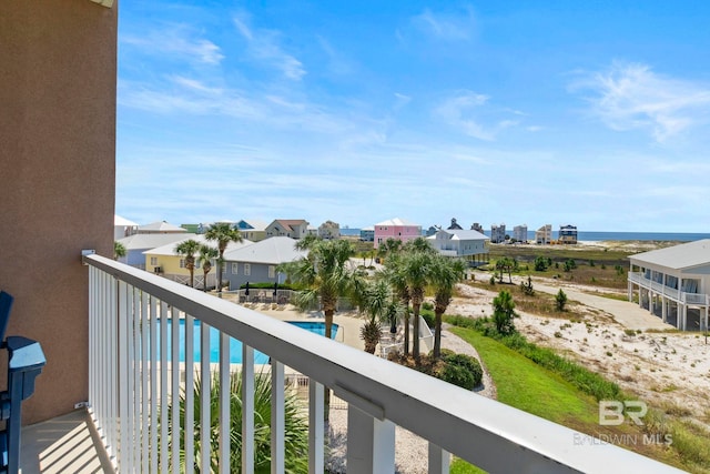 balcony featuring a community pool