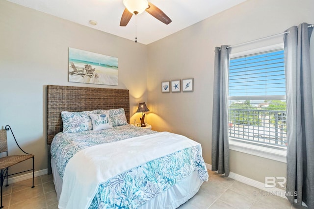 tiled bedroom featuring ceiling fan