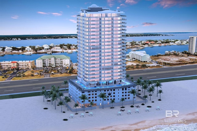 bird's eye view of apartment complex and a nearby body of water